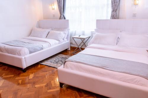 Letto o letti in una camera di Cozy Highland Private Bungalow in Eldoret