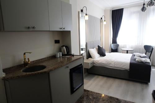 Kuchyň nebo kuchyňský kout v ubytování Mar Blanco Hotel