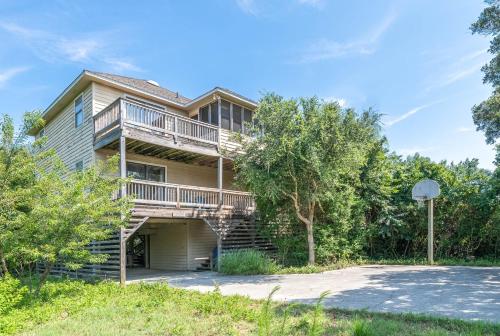 a large house with stairs leading up to it at Persimmon in Duck