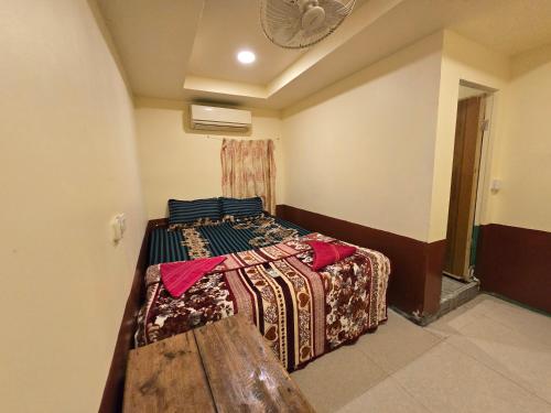 Postel nebo postele na pokoji v ubytování Family Guesthouse