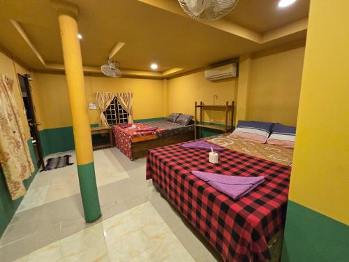 Postel nebo postele na pokoji v ubytování Family Guesthouse