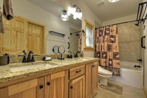 a bathroom with a sink and a toilet and a shower at Georgia Peace Chalet in New Hope