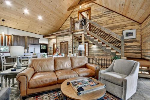 a living room with a couch and a staircase at Stardust Ridge in Northcutt