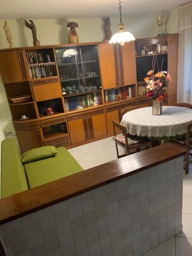 a kitchen with a table and a dining room at Casa Marianna in Marseiller