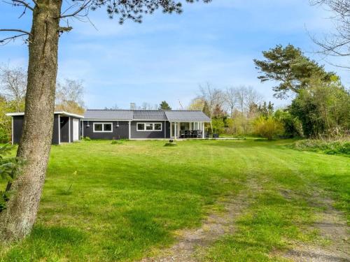 a house with a large yard in front of it at Holiday Home Alkil - 350m to the fjord by Interhome in Storvorde