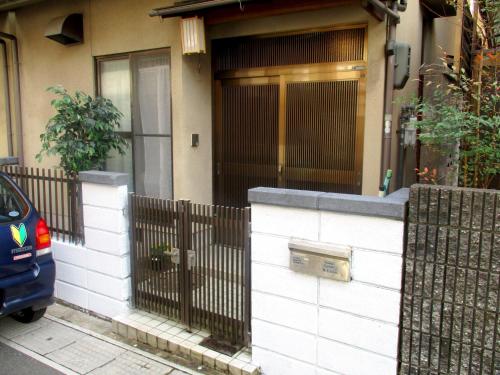 a house with a fence in front of a door at Uji - House - Vacation STAY 9753 in Uji