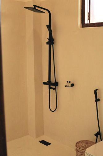 a shower stall in a bathroom with a shower at La Brisa Mirissa - Boutique hotel in Mirissa