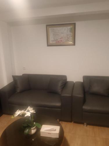 a living room with a couch and a table at Kayana Homestay Palu 