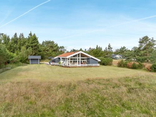 a house on a large grassy field at Holiday Home Eltje - 4km from the sea by Interhome in Blåvand