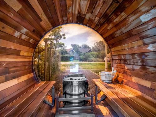 an inside view of a sauna with a window at Holiday Home Solfrid - 150m from the sea by Interhome in Esbjerg