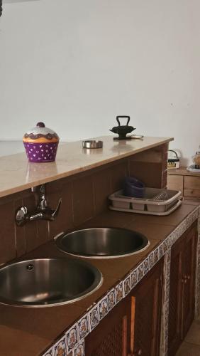 a kitchen with a sink and a counter top at CASA RURAL SANTA ELENA in Cazalla de la Sierra
