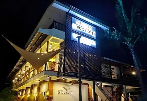 a building with a sign that reads club to hotel at Suites by Eco Hotels in El Nido