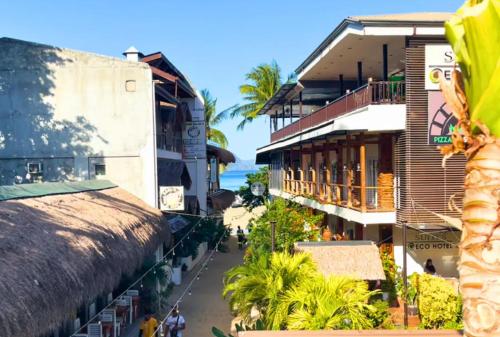 a view of a street in a city with buildings at Suites by Eco Hotels in El Nido