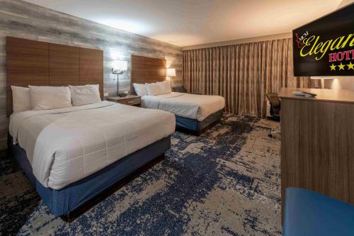 Ένα ή περισσότερα κρεβάτια σε δωμάτιο στο MCM Elegante Hotel