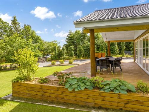 a wooden deck with a gazebo at Holiday Home Skip - 300m to the fjord by Interhome in Højslev