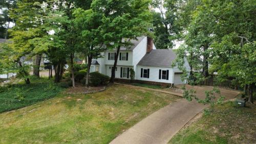 an aerial view of a white house with a driveway at Modern Vast Southern Home with Pool Near Shops in Memphis