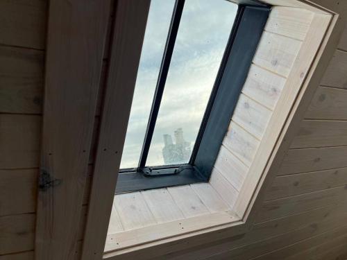 a window in a room with a view of a city at Cozy Seaside Retreat in Peterhead in Boddam