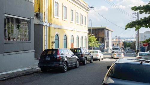 a group of cars parked on the side of a street at Boho Oasis by the Beach in San Juan