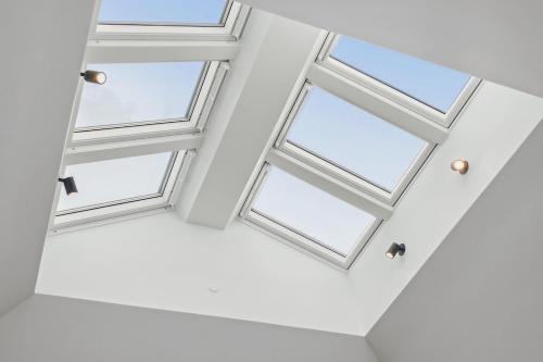 two windows in a room with white ceilings at Luxury appartment in the embassy-area in Hellerup in Hellerup