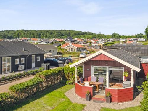 an aerial view of a small house in a town at Holiday Home Anselmi - 25m from the sea by Interhome in Sjølund