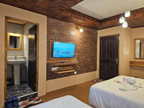 Ένα ή περισσότερα κρεβάτια σε δωμάτιο στο Hotel Golden Orchid