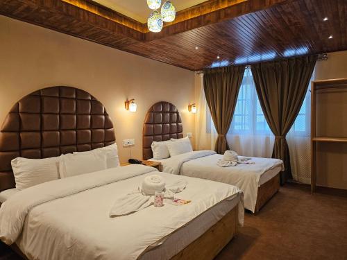 Ένα ή περισσότερα κρεβάτια σε δωμάτιο στο Hotel Golden Orchid