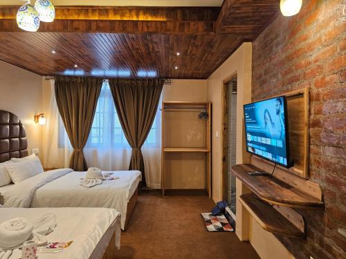 Μια τηλεόραση ή/και κέντρο ψυχαγωγίας στο Hotel Golden Orchid