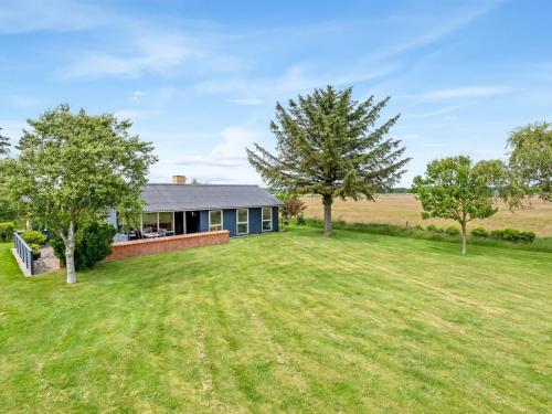 an image of a house with a large yard at Holiday Home Atena - 200m from the sea by Interhome in Hals