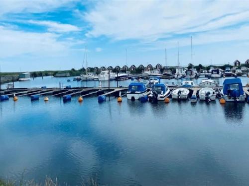 a bunch of boats parked in a marina at Holiday Home Sakulf - 500m from the sea by Interhome in Sæby
