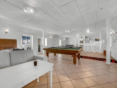 a living room with a pool table in it at Holiday Home Brigitte - 1-3km to the fjord by Interhome in Skjern
