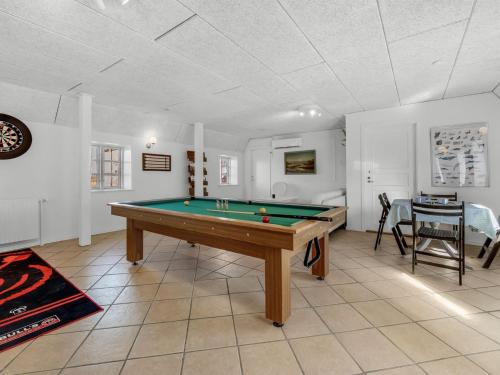 a living room with a pool table in it at Holiday Home Brigitte - 1-3km to the fjord by Interhome in Skjern