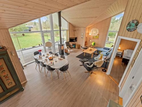an overhead view of a living room with a table and chairs at Holiday Home Teija - 600m to the fjord by Interhome in Skjern