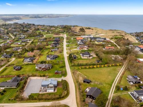 an aerial view of a subdivision of houses and the ocean at Holiday Home Lenya - 300m to the fjord by Interhome in Struer