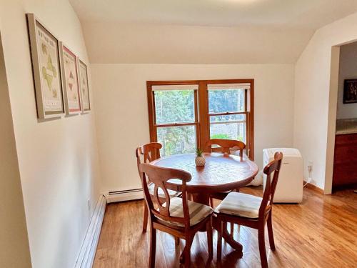 a dining room with a table and chairs at Torch Lake Vista With Lake access in Rapid City