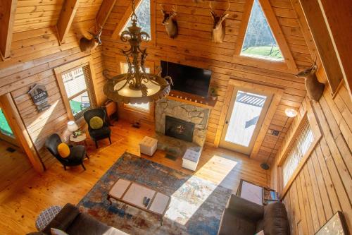 an overhead view of a living room with a fireplace at Fish, Soak, Play- River Song Retreat in Crumpler