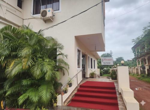 a red carpet on the side of a building at Hotel Spring Height Hotels Near Mall De Goa in Porvorim