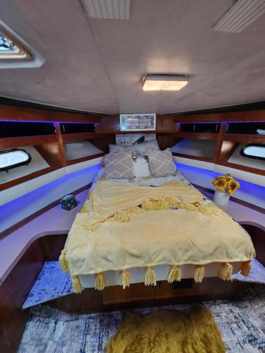 a bed in the middle of a room at Yacht Rental in Cranston