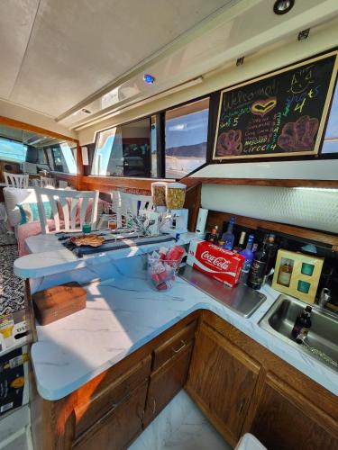 a kitchen on a boat with a counter and a sink at Yacht Rental in Cranston