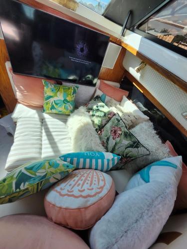 a group of pillows and cushions on a couch at Yacht Rental in Cranston