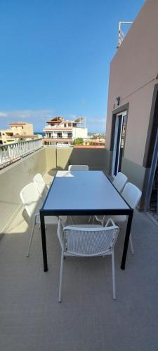 a table and chairs on top of a balcony at Atico ULISES in Valle Gran Rey