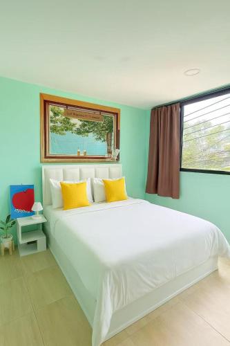 Postel nebo postele na pokoji v ubytování Chen Inn Boutique Hotel 普吉岛心澄酒店