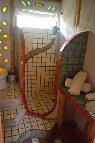 a bathroom with a mirror and a sink at Casa Bambú Veracruz in El Zapote