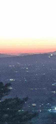 an aerial view of the ocean at sunset at "FUERTE " Affittacamere in Montevettolini