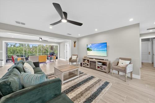 a living room with a couch and a ceiling fan at Sugarfish in Sanibel Island