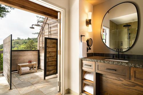 a bathroom with a sink and a mirror at Alila Ventana Big Sur - Inclusive Resort in Big Sur