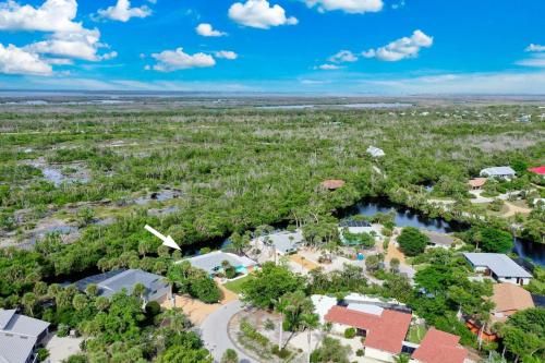 an aerial view of a resort with trees and buildings at Sugarfish in Sanibel Island