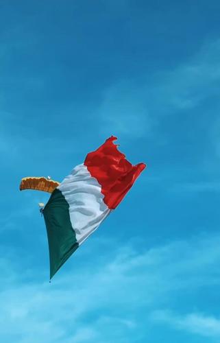 a kite flying in the blue sky at Le stanze di NinFa in Pacentro