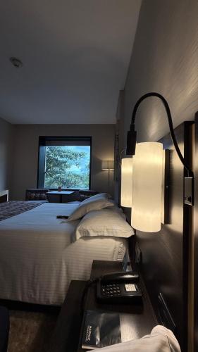 Postel nebo postele na pokoji v ubytování Cité Hotel
