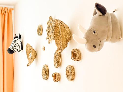 a wall with a bunch of animal decorations on it at Apartamento Cee Centro - Playa by ALÔGA in Cee