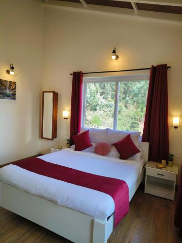 a bedroom with a large bed with a window at Hope Horizon Villa Coonoor by LexStays in Coonoor